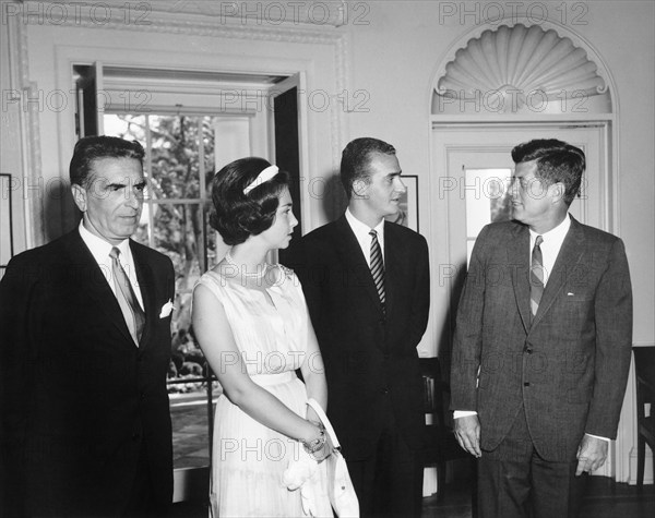 U.S. President John F. Kennedy meeting with Prince Juan Carlos of Spain (second from right) and his wife, Princess Sophia of Greece; Ambassador of Spain, Antonio Garrigues y Díaz-Cañabate, Oval Office, White House, Washington, D.C., USA, Abbie Rowe, White House Photographs, August 30, 1962