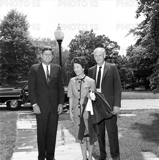 U.S. President John F. Kennedy visiting with aviator Charles A. Lindbergh and his wife, Anne Morrow Lindbergh, on walkway from Oval Office to South Lawn, White House, Washington, D.C., USA,  Robert Knudsen, White House Photographs, May 11, 1962