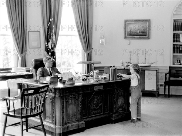 U.S. President John F. Kennedy and his daughter Caroline in Oval Office, White House, Washington, D.C., USA, Robert Knudsen, White House Photographs, May 16, 1962