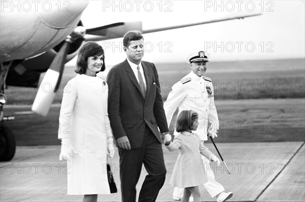 U.S. President John F. Kennedy greeting U.S. First Lady Jacqueline Kennedy and Caroline Kennedy upon their arrival from Italy, Quonset Point Naval Air Station Kingstown, Rhode Island, USA, Robert Knudsen, White House Photographs, August 31, 1962