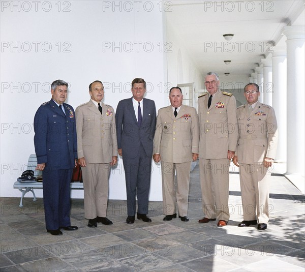 U.S. President John F. Kennedy standing with the Joint Chiefs of Staff, left to right: General Curtis E. LeMay, U.S. Air Force; General Lyman L. Lemnitzer, Chairman of the Joint Chiefs of Staff; General George H. Decker, U.S. Army; Admiral George W. Anderson, Jr., U.S. Navy; General David M. Shoup, U.S. Marine Corps; White House, Washington, D.C., USA, Robert Knudsen, White House Photographs, July 10, 1962