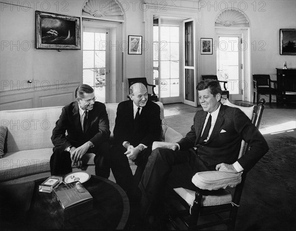 U.S. President John F. Kennedy (in rocking chair) meeting with U.S. Secretary of Defense, Robert S. McNamara (left), and U.S. Secretary of State, Dean Rusk, Oval Office, White House, Washington, D.C., USA, Abbie Rowe, White House Photographs, December 10, 1962