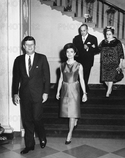 U.S. President John F. Kennedy and First Lady Jacqueline Kennedy arrive in Entrance Hall for diplomatic reception, Ambassador of Nicaragua and Dean of the Diplomatic Corps, Dr. Guillermo Sevilla-Sacasa, and Lillian Somoza de Sevilla-Sacasa in background, White House, Washington, D.C., USA, Abbie Rowe, White House Photographs, February 21, 1963