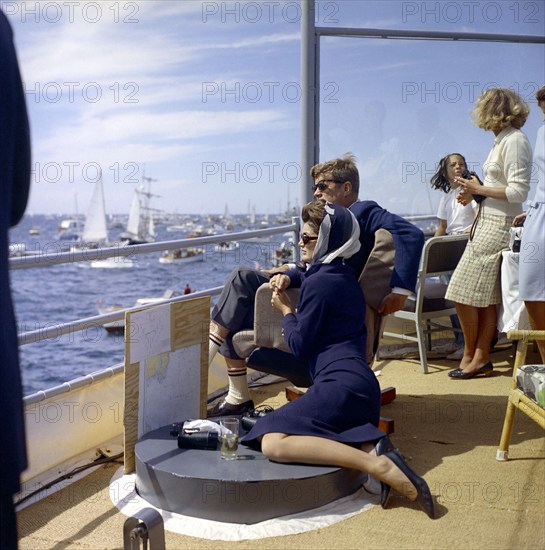 U.S. President John F. Kennedy and U.S. First Lady Jacqueline Kennedy watching first race of America's Cup from aboard USS Joseph P. Kennedy, Jr., Newport, Rhode Island, USA, Robert Knudsen, White House Photographs, September 15, 1962