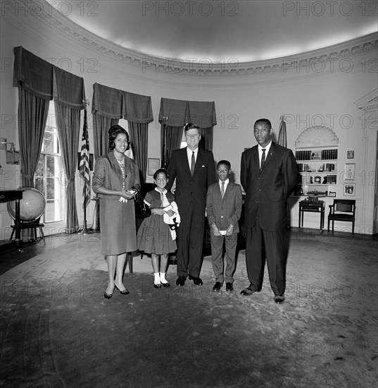 U.S. President John F. Kennedy (center) visiting with Myrlie Evers (far left), widow of civil rights leader, Medgar Evers, her children Reena and Darrell Evers and Charles Evers (far right), brother of Medgar, Oval Office, White House, Washington, D.C., USA, Cecil Stoughton, White House Photographs, June 21, 1963