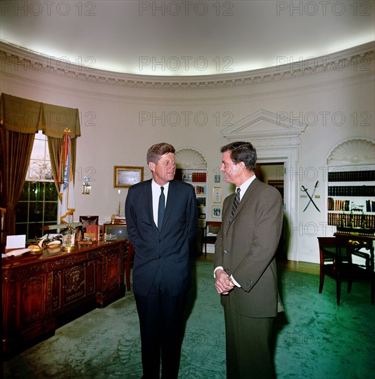 U.S. President John F. Kennedy visiting with American actor Cliff Robertson (right), who portrayed then-Lieutenant John F. Kennedy in the film, "PT 109", Oval Office, White House, Washington, D.C., USA,  Cecil Stoughton, White House Photographs, April 24, 1963