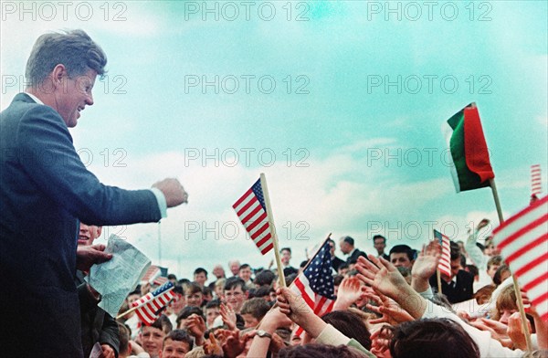 U.S. President John F. Kennedy (left) greeting crowd of Irish school children after arriving at Seán O'Kennedy Soccer Field, New Ross, County Wexford, Ireland, Robert Knudsen, White House Photographs, June 27, 1963