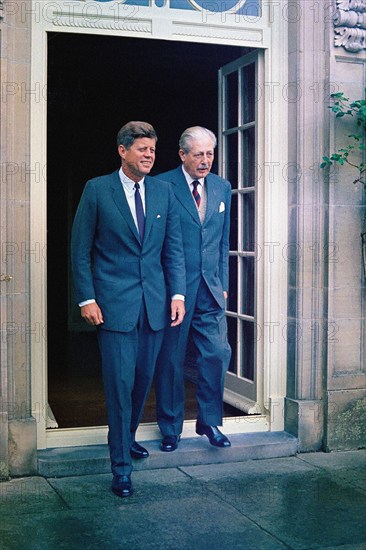 U.S. President John F. Kennedy and Prime Minister of Great Britain, Harold Macmillan, exit the Prime Minister’s residence, Birch Grove House, near Chelwood Gate, East Sussex, England, UK, Robert Knudsen, White House Photographs, June 30, 1963