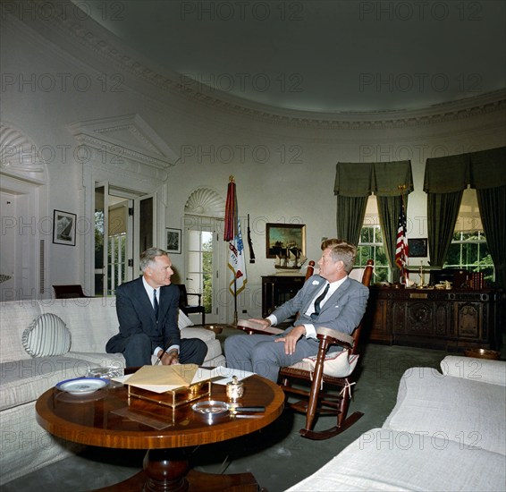 U.S. President John F. Kennedy (in rocking chair) meeting with newly-appointed U.S. Ambassador to South Vietnam, Henry Cabot Lodge, Oval Office, White House, Washington, D.C., USA, Robert Knudsen, White House Photographs, August 15, 1963