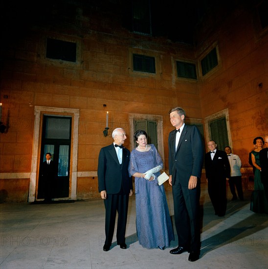 U.S. President John F. Kennedy standing with President of Italy, Antonio Segni (left), and wife, Laura Segni at dinner given in his honor, Quirinale Palace, Rome, Italy, Cecil Stoughton, White House Photographs, July 1, 1963