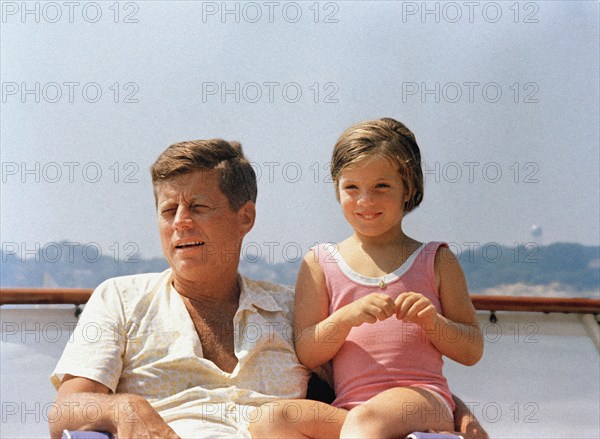 U.S. President John F. Kennedy with daughter, Caroline, on presidential yacht, Honey Fitz, Hyannis Port, Massachusetts, USA, Cecil Stoughton, White House Photographs, July 28, 1963