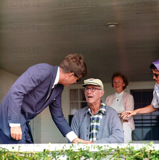 U.S. President John F. Kennedy visiting with his father, Ambassador Joseph P. Kennedy, Sr., on the porch of his home in Hyannis Port, Massachusetts, USA, Cecil Stoughton, White House Photographs, August 14, 1963