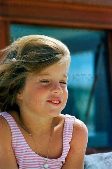 Caroline Kennedy, daughter of U.S. President John F. Kennedy and U.S. First Lady Jacqueline Kennedy, sitting aboard the Presidential yacht, “Honey Fitz,” off the coast of Hyannis Port, Massachusetts, USA, Cecil Stoughton, White House Photographs, August 25, 1963