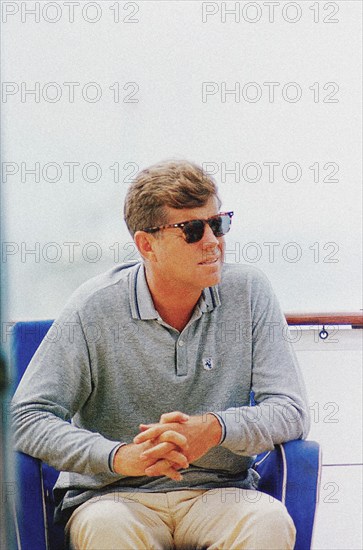 U.S. President John F. Kennedy sitting aboard Presidential yacht, “Honey Fitz,” during Labor Day weekend, Hyannis Port, Massachusetts, USA, Cecil Stoughton, White House Photographs, August 31, 1963