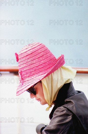 Head and shoulders profile portrait of U.S. First Lady Jacqueline Kennedy wearing pink hat and sunglasses aboard Presidential yacht, “Honey Fitz,” during Labor Day weekend, Hyannis Port, Massachusetts, USA, Cecil Stoughton, White House Photographs, August 31, 1963