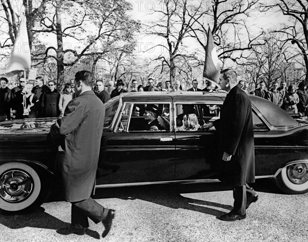 Caroline Kennedy and John F. Kennedy, Jr., riding in limousine in the funeral procession of U.S. President John F. Kennedy departing the White House for the Cathedral of St. Matthew the Apostle, Washington, D.C., USA, Abbie Rowe, White House Photographs, November 25, 1963