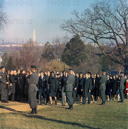 Members of the Kennedy family, led by Jacqueline Kennedy, U.S. Attorney General Robert F. Kennedy and U.S. Senator Edward Kennedy, walk to the gravesite of U.S. President John F. Kennedy upon for graveside services in the state funeral of President Kennedy, Arlington National Cemetery, Arlington, Virginia, USA, Cecil Stoughton, White House Photographs, November 25, 1963