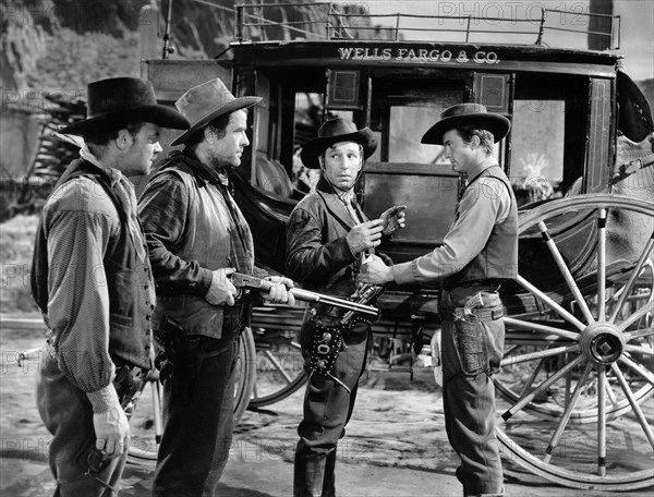 Ray Teal, Grant Withers, Lloyd Nolan, William Lundigan, on-set of the western film, "Apache Trail", MGM, 1942