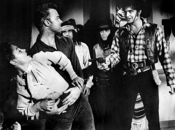 Morgan Jones (left), Joan Taylor (2nd left), Lance Fuller (right), on-set of the western film, "Apapche Woman", American Releasing Corp., 1955