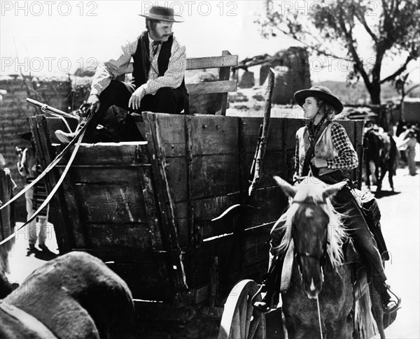 Regis Toomey, Jean Arthur, on-set of the western film, "Arizona", Columbia Pictures, 1940