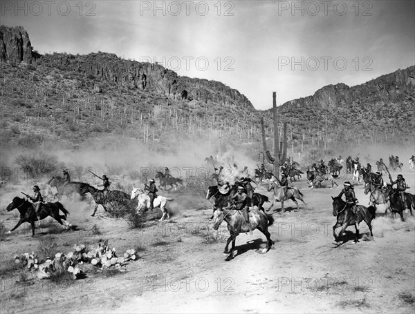 Apache Indians charging on horseback, on-set of the western film, "Arizona", Columbia Pictures, 1940