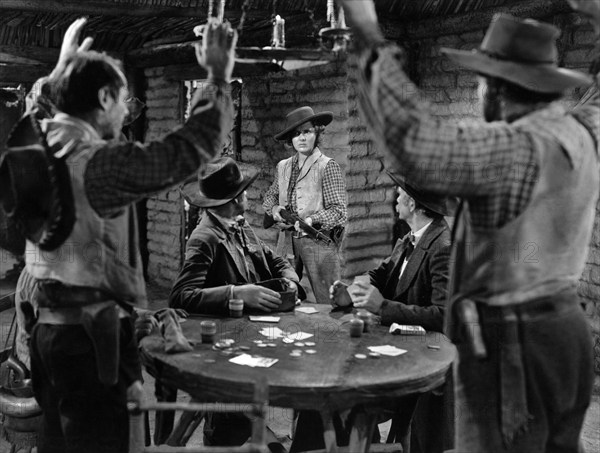 Jean Arthur (center with rifle), on-set of the western film, "Arizona", Columbia Pictures, 1940