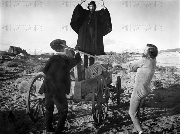 David Warner (center), Jason Robards (right), on-set of the western film, "The Battle Of Cable Hogue", Warner Bros., 1970