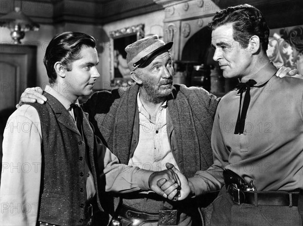 Jack Buetel, Walter Brennan, Robert Ryan, on-set of the western film, "Best Of The Badmen", RKO Radio Pictures, 1951