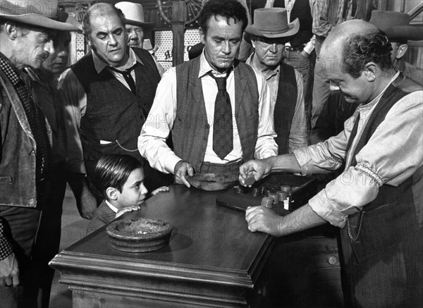 Henry Fonda (center), Robert Middleton (to the left of Fonda), Jean-Michel Michenaud (little boy), on-set of the western film, "A Big Hand For The Little Lady", Warner Bros., 1966