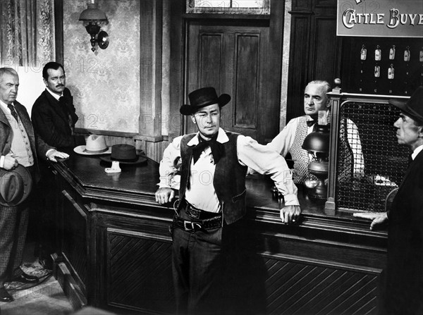 Alan Ladd (center), on-set of the western film, "The Big Land", Warner Bros., 1957