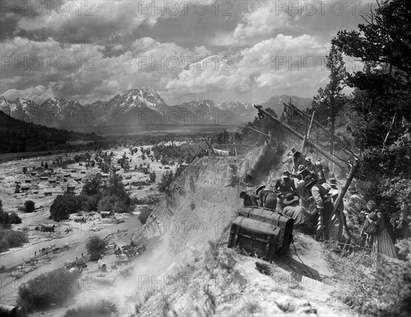 Caravan on Oregon Trail scene, on-set of the western film, "The Big Trail", Fox Film Corporation, 1930