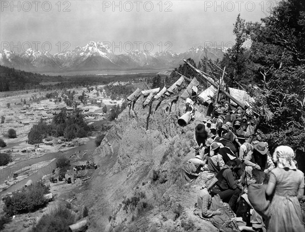 Caravan on Oregon Trail scene, on-set of the western film, "The Big Trail", Fox Film Corporation, 1930