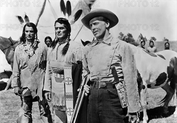 Keith Larson (left), Victor Mature (center), James Millican (right), on-set of the western film, "Chief Crazy Horse", Universal Pictures, 1955