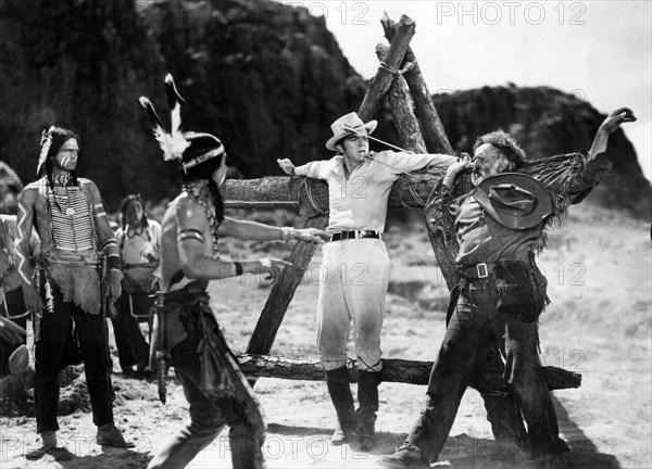 Henry Brandon (left), Dana Andrews (center), Nestor Paiva (right), on-set of the western film, "Comanche", United Artists", 1956