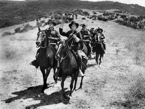 James Whitmore (foreground, left), Guy Madison (foreground, right), on-set of the western film, "The Command", Warner Bros., 1954