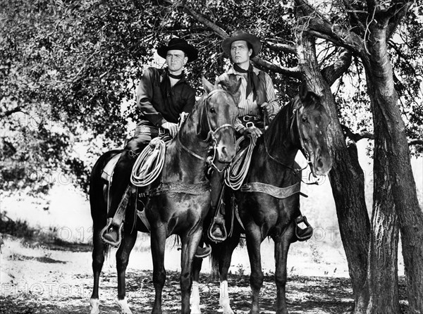 Jerome Courtland, George Montgomery, on-set of the western film, "Cripple Creek", Columbia Pictures, 1952