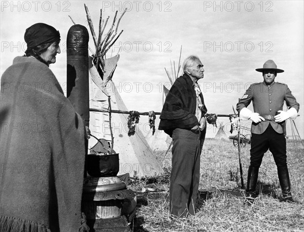 Chief Dan George (center), Kevin McCarthy (right), on-set of the western film, "Alien Thunder", aka "Dan Candy's Law", Ambassador Film Distributors, American International Pictures, Cinerama Releasing Corp., 1974