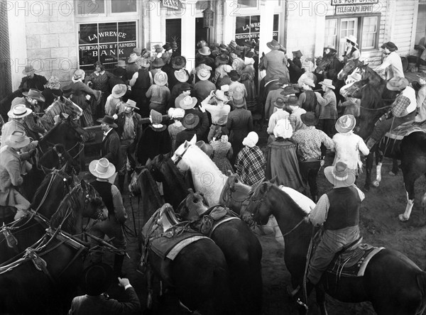 Crowd during run on the bank, on-set of the western film, "Dark Command", Republic Pictures, 1940