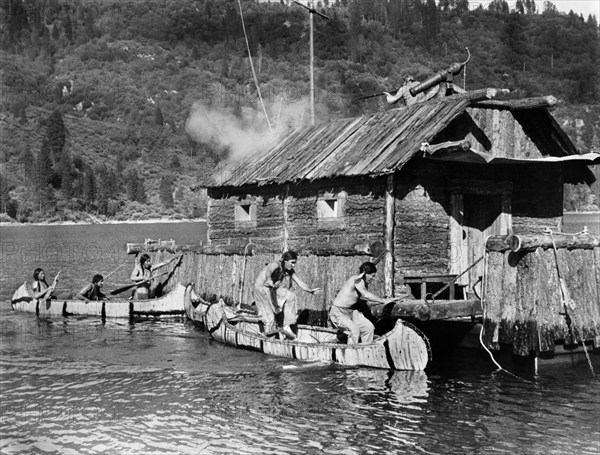 Huron warriors attacking log cabin, on-set of the western film, "The Deerslayer", 20th Century-Fox, 1957