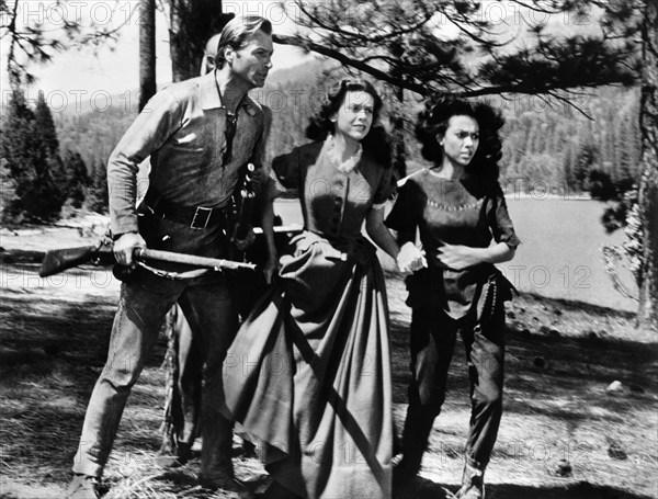 Lex Barker, Cathy O'Donnell, Rita Moreno, on-set of the western film, "The Deerslayer", 20th Century-Fox, 1957