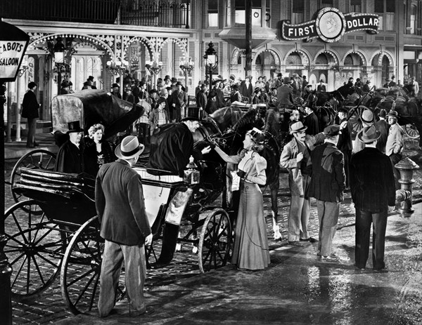 Susanna Foster (standing with hand extended next to horse-drawn carriage), on-set of the western film, "Frisco Sal", Universal Pictures, 1945