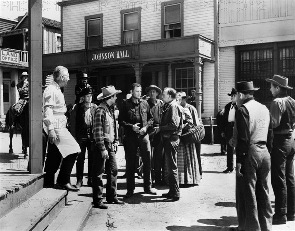 John Agar (sheriff, center), on-set of the western film, "Frontier Gun", 20th Century-Fox, 1958