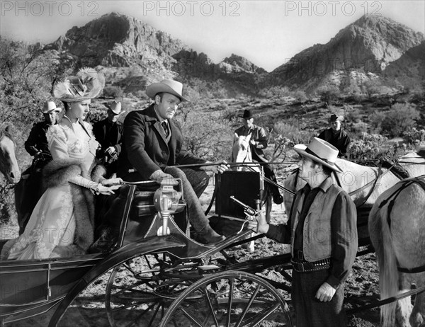 Yvonne De Carlo, Scott Brady (seated in buggy), on-set of the western film, "The Gal Who Won The West", Universal Pictures, 1949