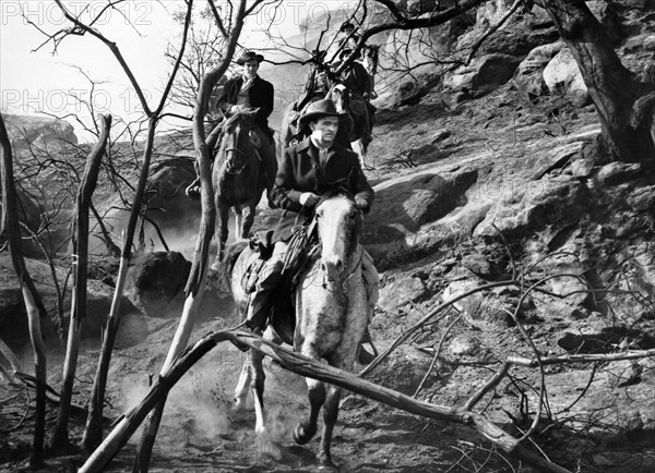 John Lund (foreground), on-set of the western film, "Five Guns West",  American Releasing Corporation, 1955