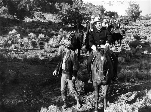 Harry Lauter (standing left), Joe Patridge (right foreground on horse), on-set of the western film, "Fort Courageous", 20th Century-Fox, 1965