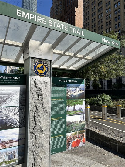 Urban bicycle path with information kiosk, Empire State Trail, Battery Park City, New York City, New York, USA