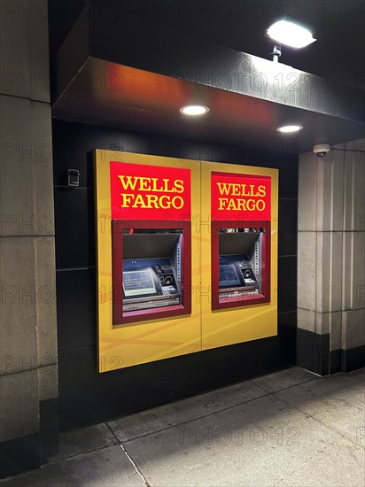 Wells Fargo bank atm machines at night, New York City, New York, USA