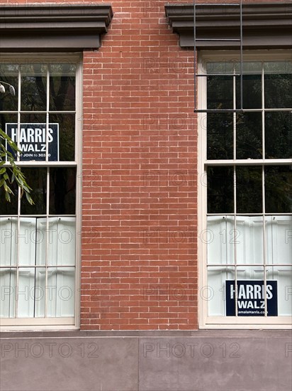 Two Harris Walz political campaign signs in residential window, Greenwich Village, New York City, New York, USA