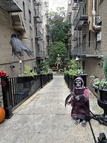 Halloween decorations between two residential buildings, Greenwich Village, New York City, New York, USA