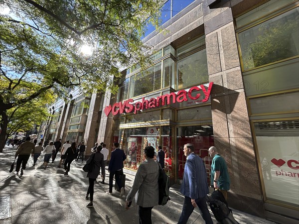 CVS Pharmacy and convenience store, building exterior and sidewalk scene, New York City, New York, USA